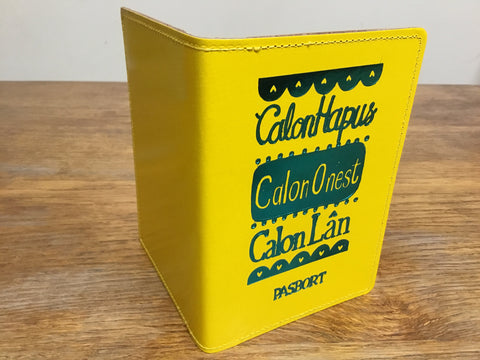 'Calon Hapus, Calon Onest, Calon Lân' Yellow Passport Cover by Lizzie Spikes